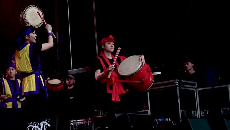 japanese taiko drummers performing on stage