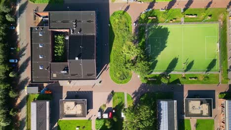 coa ter apel, shelter for asylum seekers, top down view of football field and offices