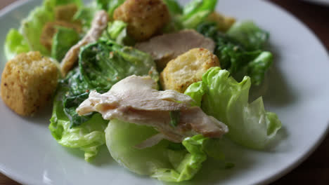 caesar salad with chicken on plate