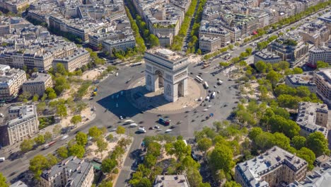 flight over paris city sunny day famous triumph arch traffic circle streets aerial timelapse panorama 4k france