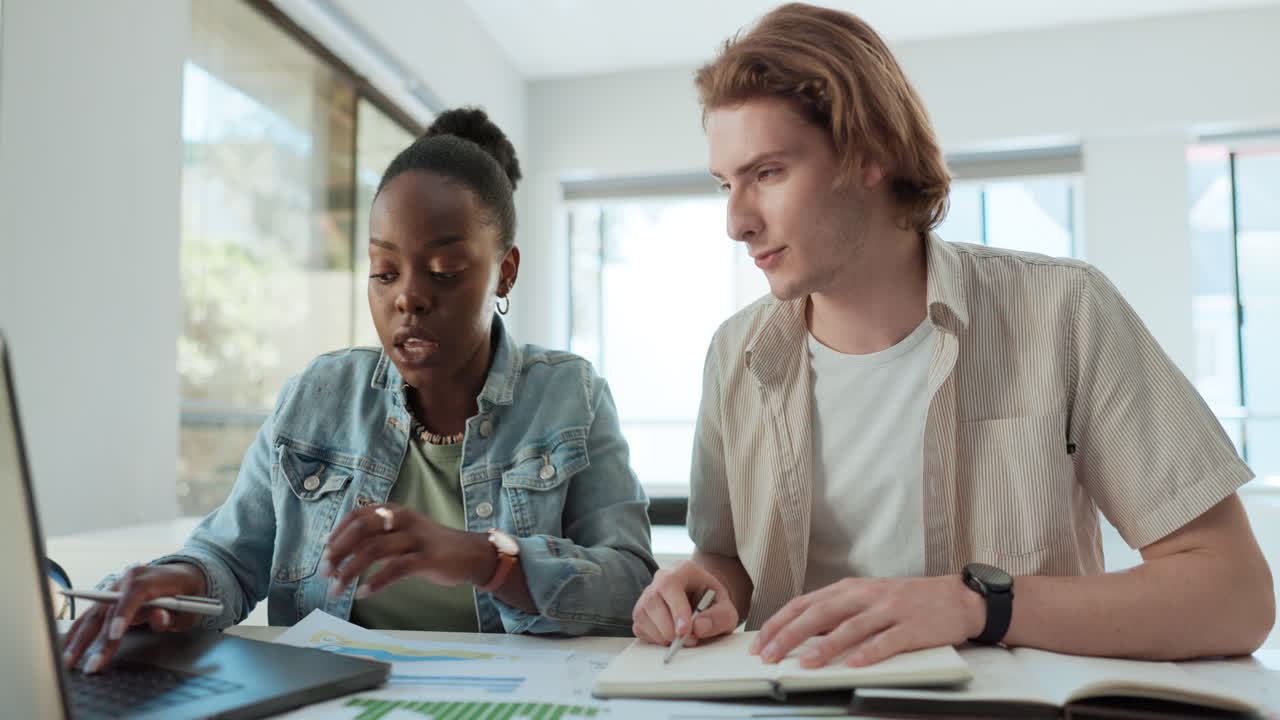 Two people collaborate on a project