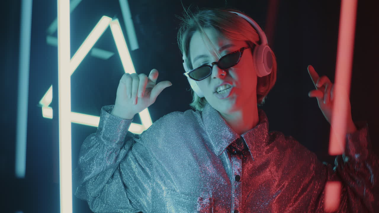 Woman Dancing Under Neon Lights