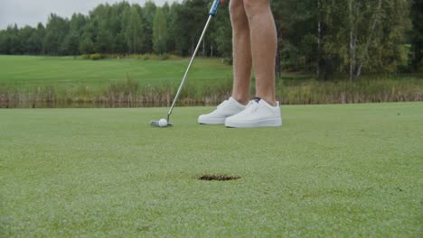 man putting on a golf course