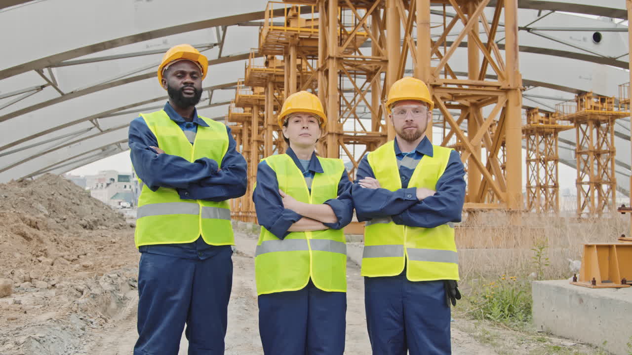 Portrait of Construction Workers by Unfinished Building