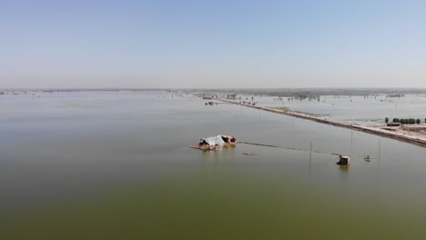 aerial view of flooded landscape in pakistan with view of makeshift tent