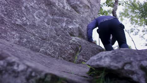 person rock climbing