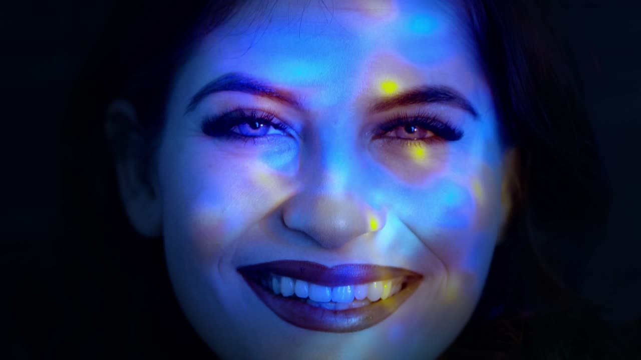 A Mystical Portrait of a Young Woman Illuminated by Cool Blue Lights, Emphasizing her Serene Expression and Captivating Features in a Unique Visual Experience