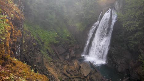 slow motion, wide shot of a waterfall viewed from above