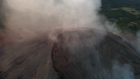 aerial view of a volcano erupting smoke