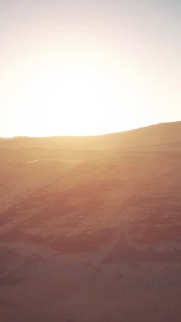 stunning sunset over sand dunes in the desert