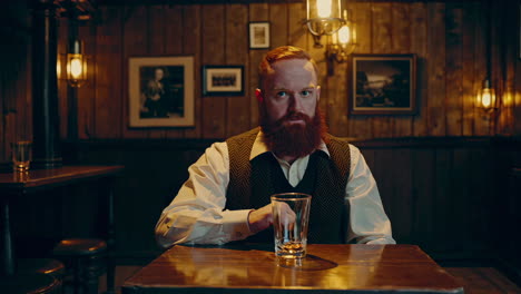 man in a pub with a drink