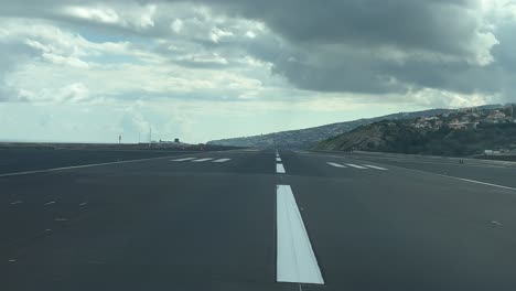 a real-time initial take-off roll as seen by the pilots from funchal airport, madeira island, portugal