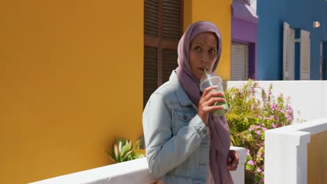 young woman wearing hijab out and about in the city