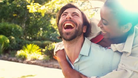 man giving piggyback ride to woman