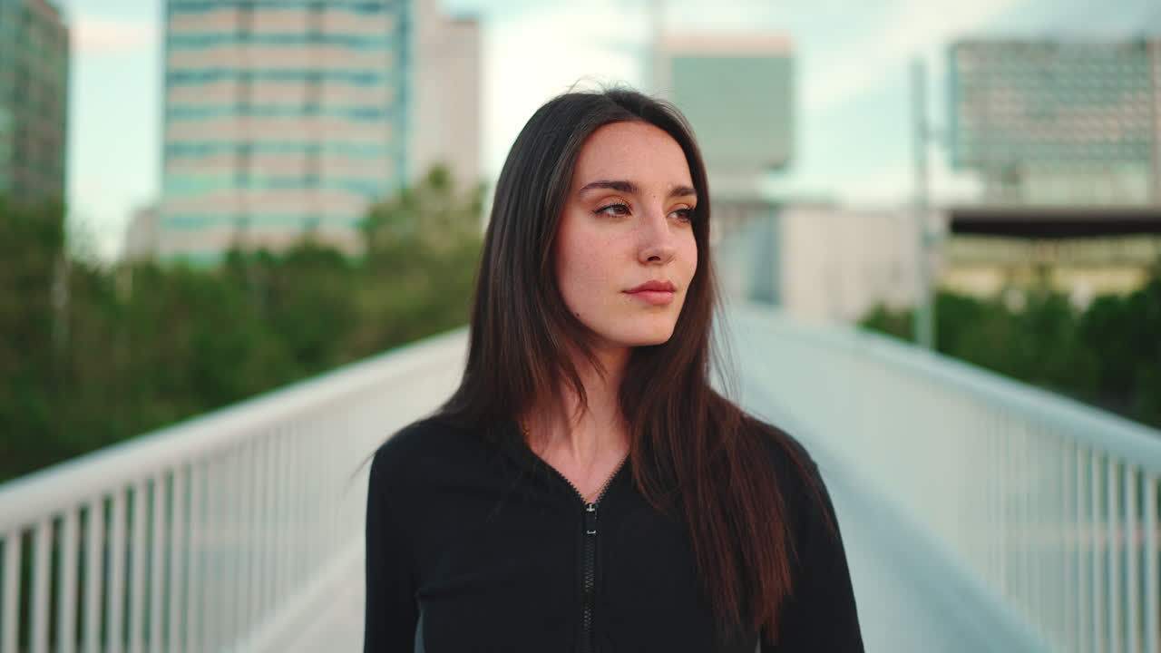 Portrait of a woman on a bridge in the city