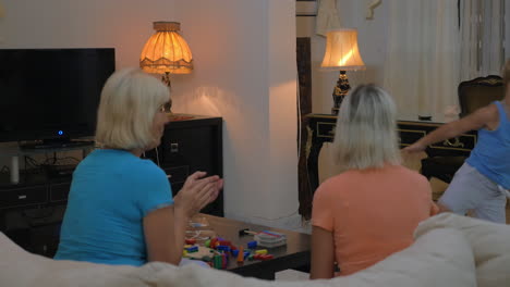 Boy-dancing-for-grandmothers-at-home