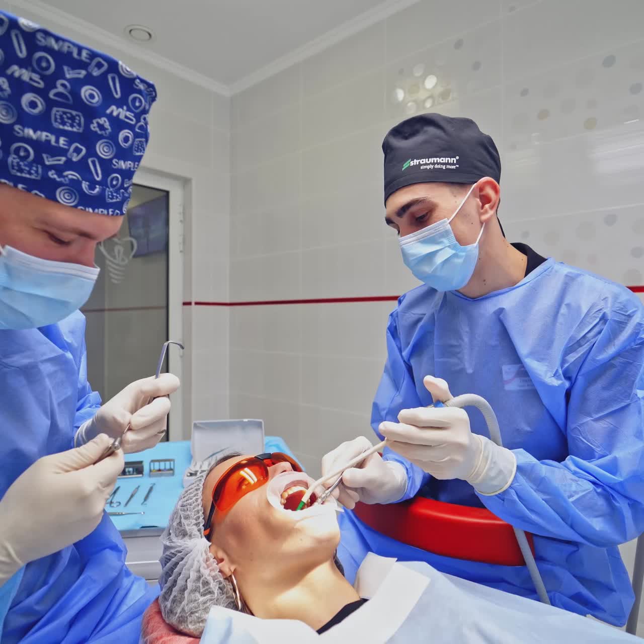 Dentist with assistant work in dental clinic
