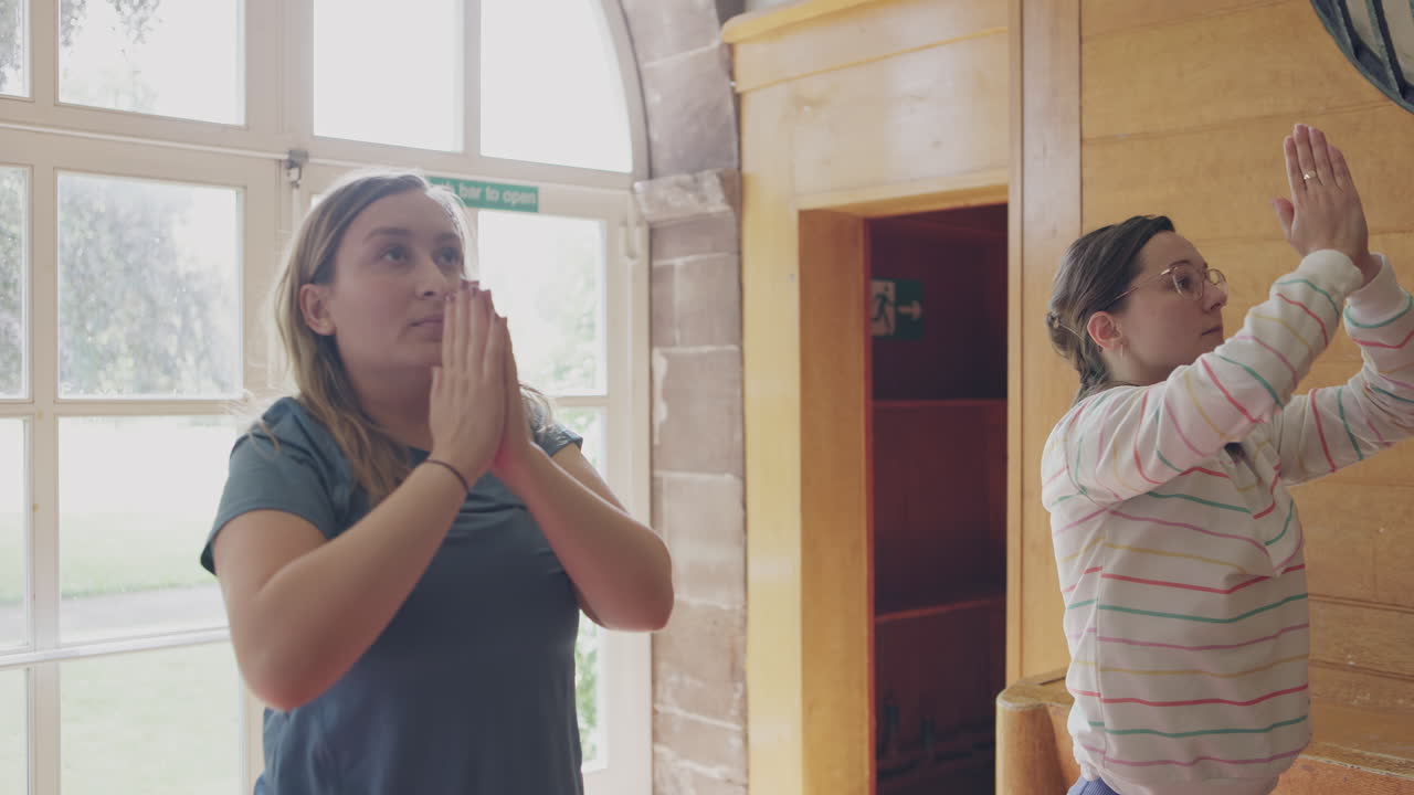 Yoga session with two women indoors