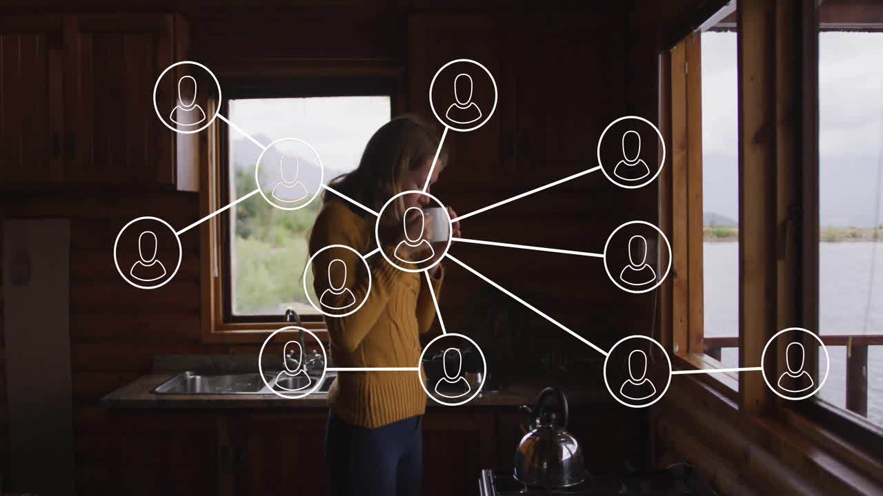 Woman sipping mug in cabin kitchen, showing animated health icons and hydration chart floating