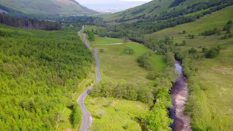 aerial footage of glen nevis road and river in scotland