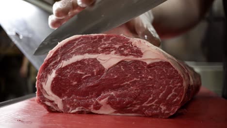 chef preparing a rib eye steak