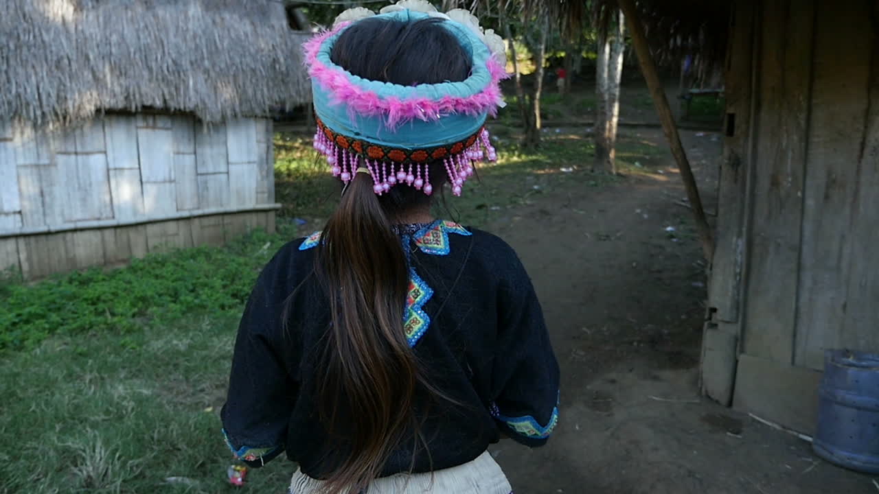 Girl in Traditional Clothing in a Village
