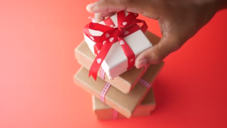 gift boxes stacked with red ribbon