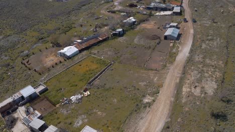 makeshift settlement near the dumpsite of burned lifejackets left by the migrants and refugees in mithymna, lesvos island, greece. - aerial drone