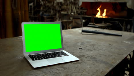 Laptop-on-a-table-in-workshop-4k