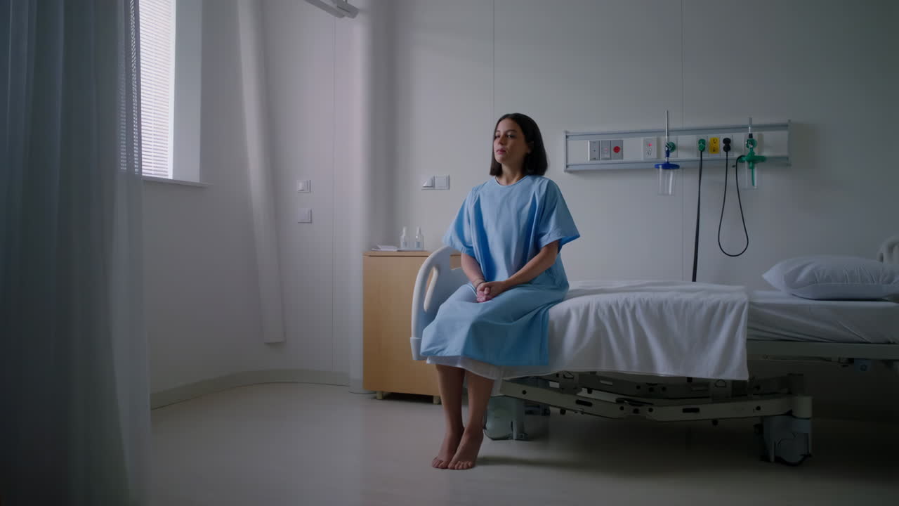 Woman sitting on a hospital bed
