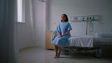 woman sitting on a hospital bed
