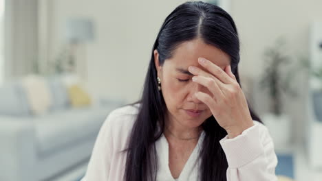 business, headache and asian woman with remote