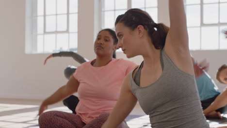 yoga-class-beautiful-caucasian-woman-exercising-practicing-poses-stretching-body-enjoying-healthy-lifestyle-in-fitness-studio