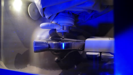 professional device in dentistry. automated dental milling machine producing prosthesis implants and artificial human teeth crowns. close-up.