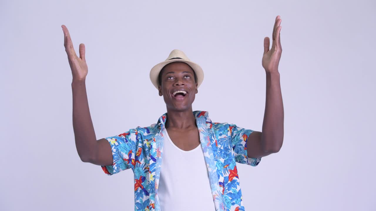 Young handsome African tourist man ready for vacation