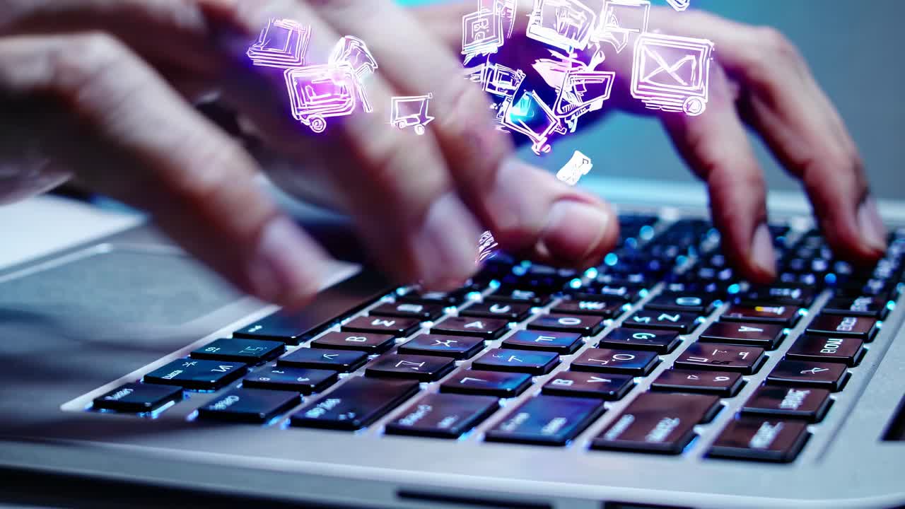 Hands typing on a laptop keyboard with digital icons floating above, symbolizing technology