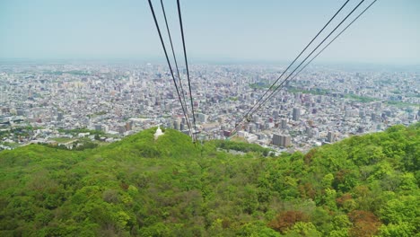 Sapporo-City-Buildings-Seen-From-Cable-Car-In-Mount-Moiwa,-Hokkaido,-Japan