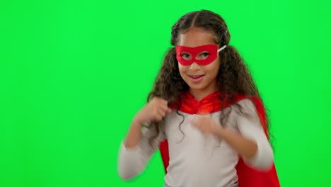 young superhero girl on green screen