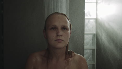 woman taking a shower being stressed