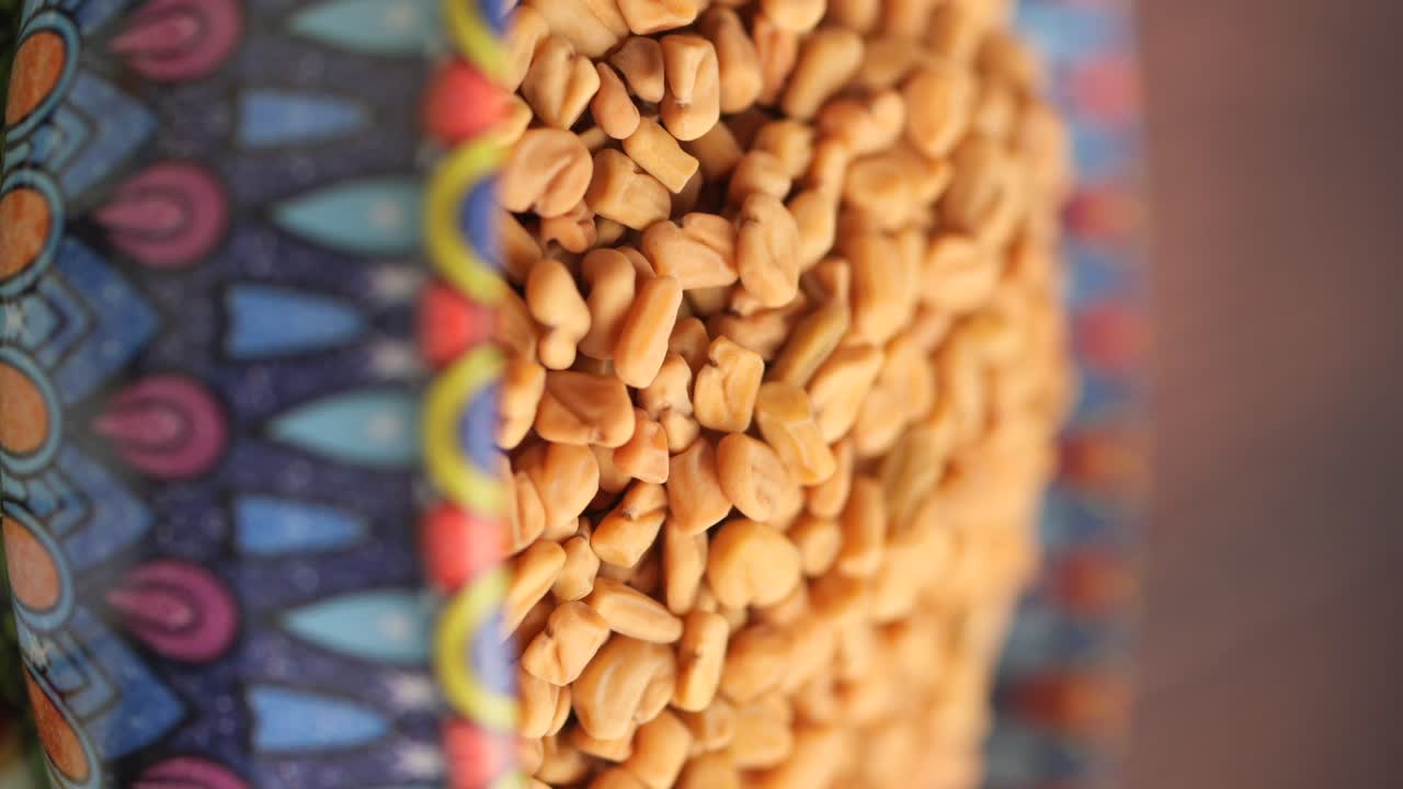 Close Up of Fenugreek Seeds in a Vibrant Patterned Bowl
