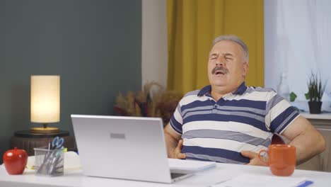 home office worker old man has stomachache.