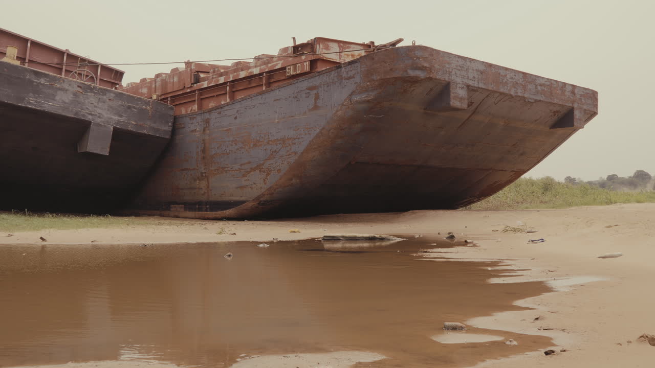 Rusty Barge on the Riverbank
