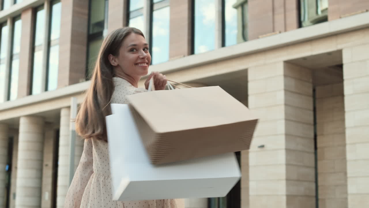 Woman Walking with Shopping Bags Smiling