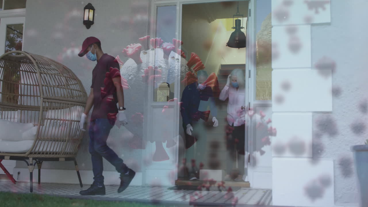 animación de células virales con una pareja caucásica mayor con máscaras faciales tomando el paquete