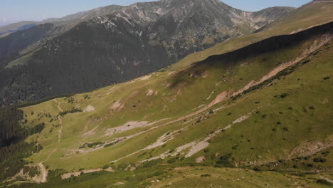 Aerial-birds-eye-view-over-the-dramatic-Carpathian-mountains,-Transylvania,-Romania