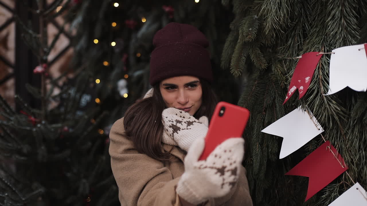 Woman taking a selfie during Christmas celebration