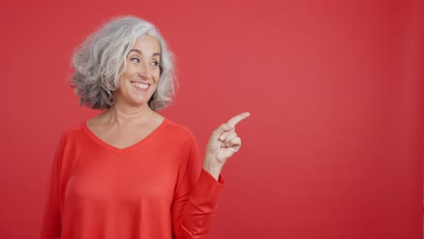 happy senior woman in a red sweater