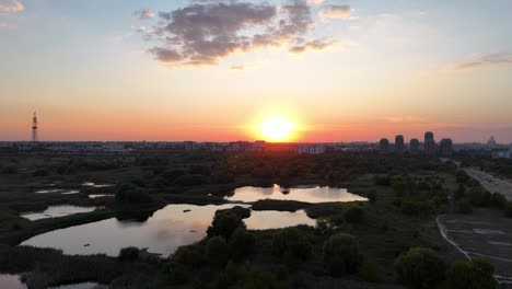 aerial view over vacaresti delta at sunset, orange, yellow, bucharest, romania