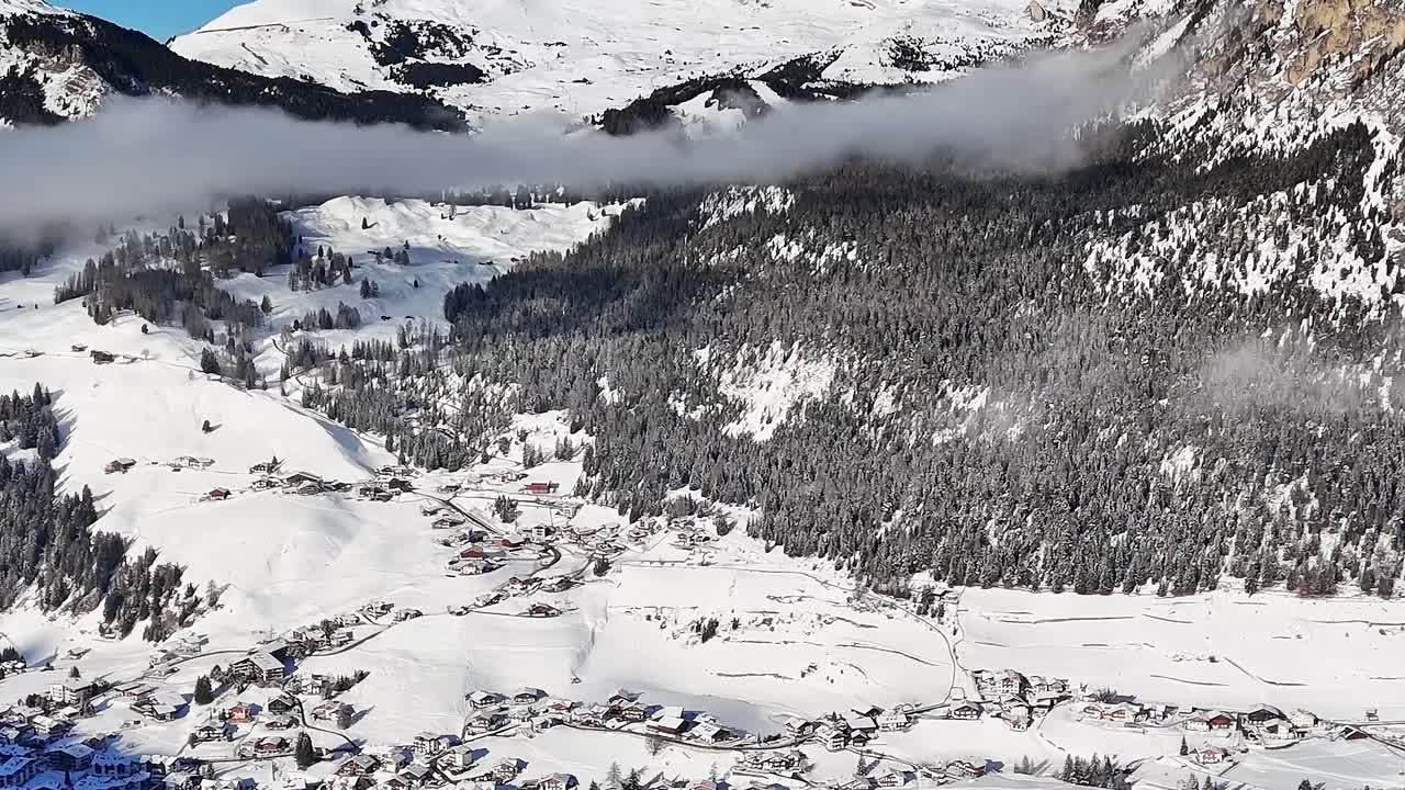 Snow-covered mountains and valleys in the Alps of Italy during winter
