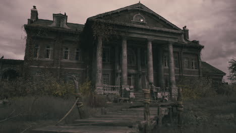 old mansion with overgrown garden in a desolate rural setting